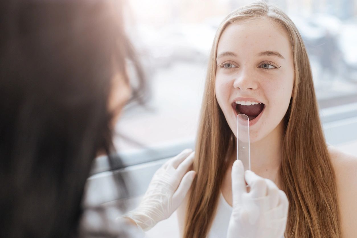 international patient with mouth open